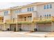New townhomes featuring garage entrances and decks on the upper levels for outdoor living and entertaining at 1903 Deco Dr, Kennesaw, GA 30144