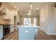 Modern kitchen featuring stainless appliances, white cabinetry, and an island with seating at 1903 Deco Dr, Kennesaw, GA 30144