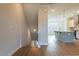 Open concept featuring a kitchen with pendant lighting and wood flooring at 1903 Deco Dr, Kennesaw, GA 30144