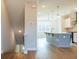 Open concept featuring a kitchen with pendant lighting and wood flooring at 1903 Deco Dr, Kennesaw, GA 30144