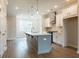 Spacious kitchen with center island, stainless steel appliances, and lots of natural light at 1903 Deco Dr, Kennesaw, GA 30144
