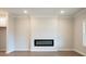 Modern living room with hardwood floors and electric fireplace at 1903 Deco Dr, Kennesaw, GA 30144