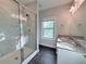Beautiful bathroom with marble-tiled shower and double sink vanity at 3076 Quantum Ln, Atlanta, GA 30341