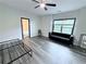 Large bedroom featuring a modern design, big window, grey-tone wood flooring and ceiling fan at 3076 Quantum Ln, Atlanta, GA 30341