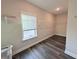 Walk-in closet features wire shelving, light gray walls, and a window providing natural light at 3076 Quantum Ln, Atlanta, GA 30341