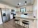 Modern kitchen with stainless steel appliances, granite countertops, and stylish breakfast bar at 3076 Quantum Ln, Atlanta, GA 30341