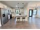 Spacious kitchen with stainless steel appliances and a breakfast bar with stools at 3076 Quantum Ln, Atlanta, GA 30341