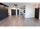 Open-concept living room with modern lighting and neutral decor at 3076 Quantum Ln, Atlanta, GA 30341