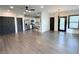 Spacious living room with modern lighting and an adjacent kitchen area at 3076 Quantum Ln, Atlanta, GA 30341