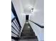 View up the staircase of the townhouse with dark wood railings at 3076 Quantum Ln, Atlanta, GA 30341