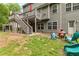 A spacious backyard features a fire pit, comfortable seating, and an open patio area for outdoor enjoyment at 4545 Evandale Way, Cumming, GA 30040