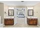 This bathroom features and sinks and an entrance to the main bedroom at 4545 Evandale Way, Cumming, GA 30040