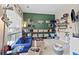 Playful ' room with bright green accent wall, shelving, and a cozy blue couch at 4545 Evandale Way, Cumming, GA 30040