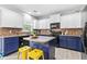 Well-designed kitchen featuring updated appliances, and an island with barstool seating at 4545 Evandale Way, Cumming, GA 30040
