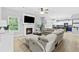 Bright living room featuring a fireplace, TV, ceiling fan and comfortable neutral furnishings at 4545 Evandale Way, Cumming, GA 30040