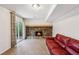 Cozy basement featuring stone fireplace and sliding glass doors to the outside at 875 Waterbrook Ct, Roswell, GA 30076