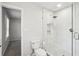 Stylish bathroom with walk-in shower that includes white marble tiling and modern fixtures at 875 Waterbrook Ct, Roswell, GA 30076