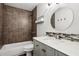 Updated bathroom features a large vanity with granite countertop and tiled shower with tub at 875 Waterbrook Ct, Roswell, GA 30076