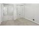 Spacious bedroom with mirrored closet doors and neutral carpet at 875 Waterbrook Ct, Roswell, GA 30076