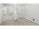 Bedroom with neutral carpet, mirrored closet doors, and great natural light at 875 Waterbrook Ct, Roswell, GA 30076