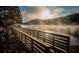 Picturesque lakeside boardwalk with stunning water views and serene natural surroundings at 875 Waterbrook Ct, Roswell, GA 30076