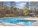 Community pool with ample space for lounging and relaxing in the sun at 875 Waterbrook Ct, Roswell, GA 30076