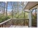 View from back deck overlooking the tree-lined yard and greenery at 875 Waterbrook Ct, Roswell, GA 30076