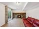 Cozy living room with a striking stone fireplace and access to the outdoors through sliding glass doors at 875 Waterbrook Ct, Roswell, GA 30076