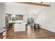 Bright open-concept living space features wood floors, eat-in kitchen, and deck access at 875 Waterbrook Ct, Roswell, GA 30076
