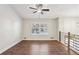 Spacious loft featuring wood floors, large windows, modern railing, and ample natural light at 875 Waterbrook Ct, Roswell, GA 30076