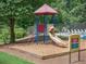 Gathering-friendly playground with slide and climbing area, adjacent to a pool and seating for relaxing at 875 Waterbrook Ct, Roswell, GA 30076
