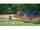 Community playground with swings, slides, and climbing structures in a safe, enclosed area at 875 Waterbrook Ct, Roswell, GA 30076