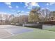 Community tennis courts featuring multiple playing surfaces for residents to play on at 875 Waterbrook Ct, Roswell, GA 30076