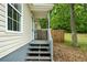 Side porch offers a perfect spot for relaxing and enjoying the outdoors at 1031 Abercorn Way, Douglasville, GA 30134