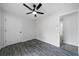 Comfortable bedroom featuring a ceiling fan and hardwood floors at 1031 Abercorn Way, Douglasville, GA 30134