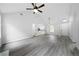 Bright and spacious living room flowing into the kitchen area, featuring high ceilings at 1031 Abercorn Way, Douglasville, GA 30134