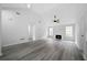 Spacious living room featuring high ceilings, a fireplace, and modern flooring at 1031 Abercorn Way, Douglasville, GA 30134