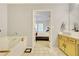 Bright bathroom with a soaking tub and a view into the bedroom, creating a relaxing retreat at 2457 Birkhall Way, Lawrenceville, GA 30043