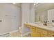 Bathroom showcasing a clean design, single vanity, and glass-enclosed shower for convenience and style at 2457 Birkhall Way, Lawrenceville, GA 30043