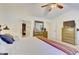 Spacious bedroom with neutral tones, ample closet space, and a comfortable king-sized bed at 2457 Birkhall Way, Lawrenceville, GA 30043