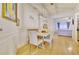 Bright dining room with wood floors, modern light fixture, and stylish decor at 2457 Birkhall Way, Lawrenceville, GA 30043