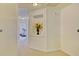 Bright hallway with natural light and a decorative niche enhancing the home's aesthetic at 2457 Birkhall Way, Lawrenceville, GA 30043