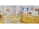Open kitchen with granite countertops, stainless appliances, and breakfast bar at 2457 Birkhall Way, Lawrenceville, GA 30043