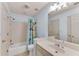 Bright bathroom with a tub-shower combination, single vanity, and neutral tile flooring, perfect for Gathering use at 486 Milledge Gate Se Ter, Marietta, GA 30067