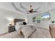 Primary bedroom features a tray ceiling, carpeted floors and a ceiling fan at 486 Milledge Gate Se Ter, Marietta, GA 30067