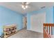 Cozy Bedroom with a crib, changing table, and ample closet space, all painted in calming blue tones at 486 Milledge Gate Se Ter, Marietta, GA 30067