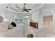 Primary bedroom features a tray ceiling, carpeted floors and a ceiling fan at 486 Milledge Gate Se Ter, Marietta, GA 30067