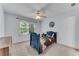 Charming bedroom with a single bed, ceiling fan, and a window offering plenty of natural light at 486 Milledge Gate Se Ter, Marietta, GA 30067