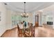 Formal dining room with hardwood floors, chandelier, and an adjacent foyer at 486 Milledge Gate Se Ter, Marietta, GA 30067