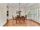 Elegant dining room with hardwood floors, tray ceilings, and a chandelier at 486 Milledge Gate Se Ter, Marietta, GA 30067